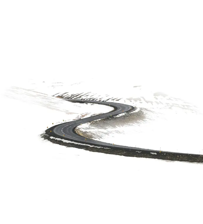 free roadway surrounded by snow